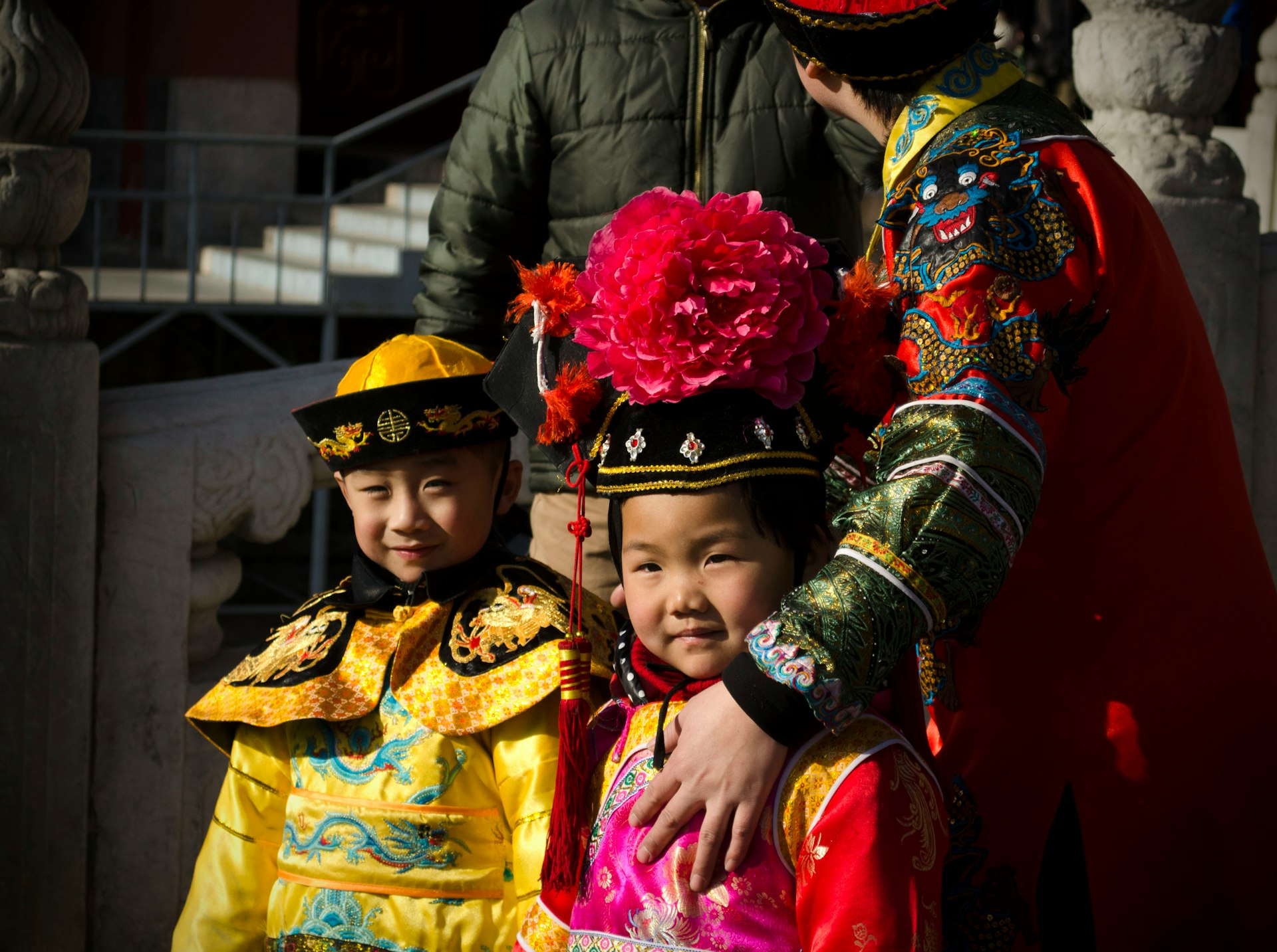 2 women in yellow and red traditional dress