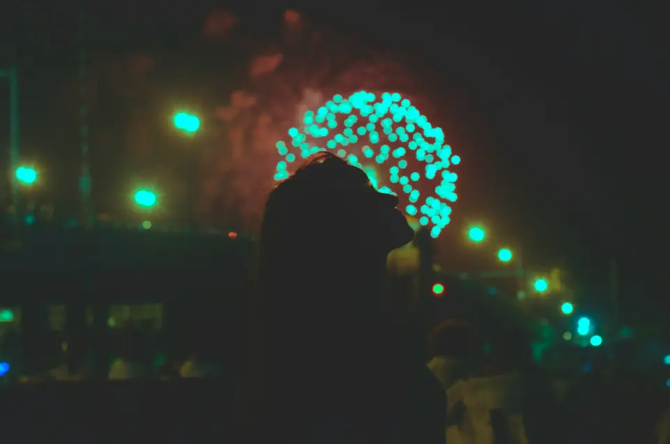 silhouette of woman standing near tree